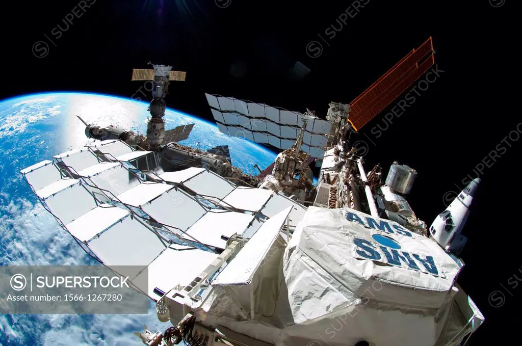 Astronaut Ron Garan took this image during the spacewalk conducted on Tues., July 12, 2011. It shows the International Space Station with Space Shuttl...