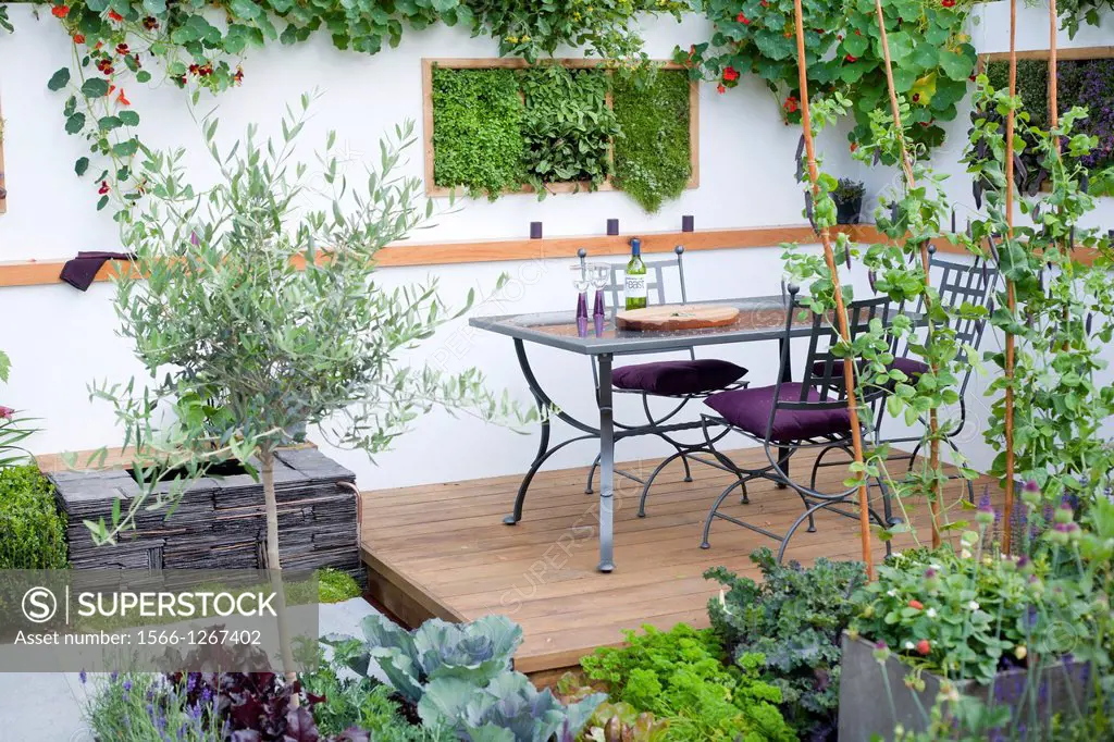 Dining area in contemporary garden design, London England.