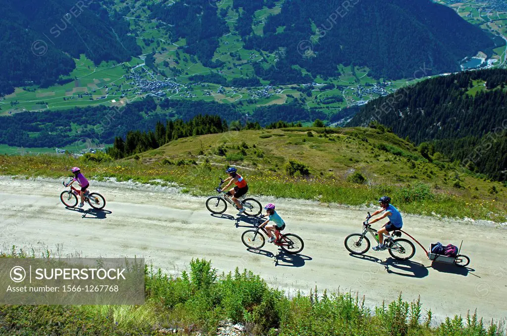 Family on a bike tour above the Val de Bagnes near Verbier, Valais, Switzerland
