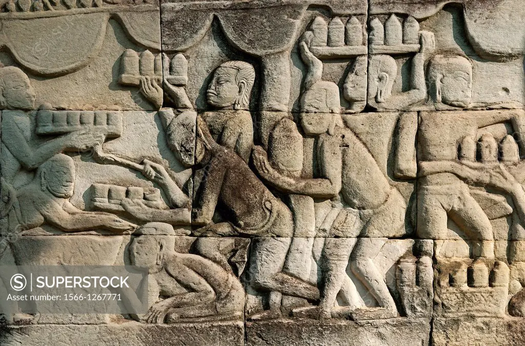 Bas-relief carved in stone depicting genre scenes of daily life along the shores of Tonle Sap, this panel shows cooks preparing food and drinks for th...