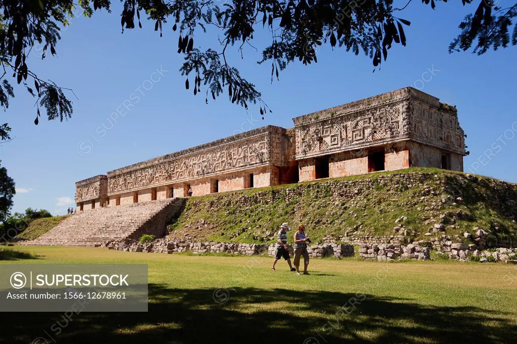 Tourists walking around the Palacio del Gobernador-Governor´s Palace, Maya archeological site Uxmal, Yucatan Province, Mexico, Central America.