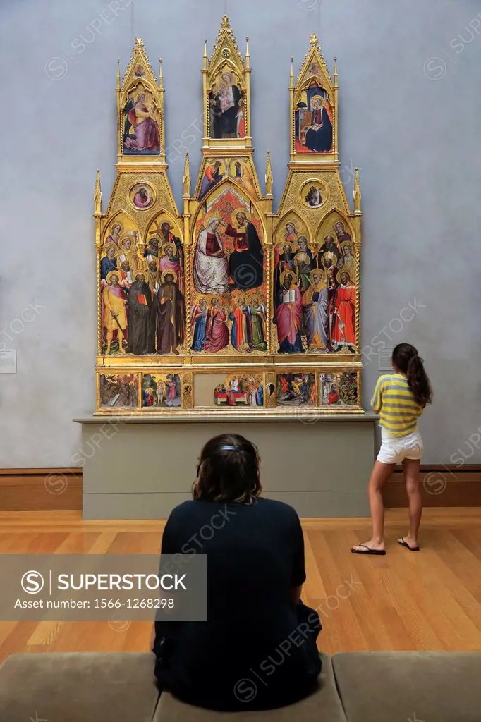 Visitors looking at the altarpiece of The Coronation of the Virgin with Saints by Cenni di Francesco di Ser Cenni. Getty Center. Los Angeles. Californ...