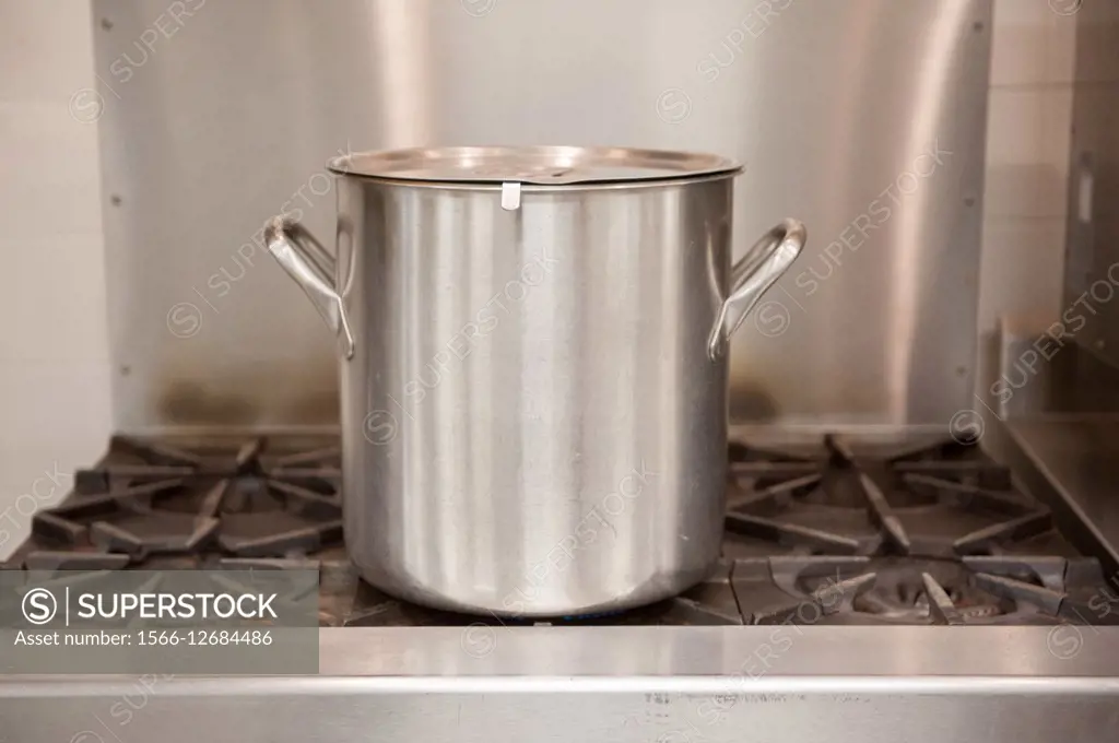 Stainless steel soup pot on range top in Denton, Maryland, USA.