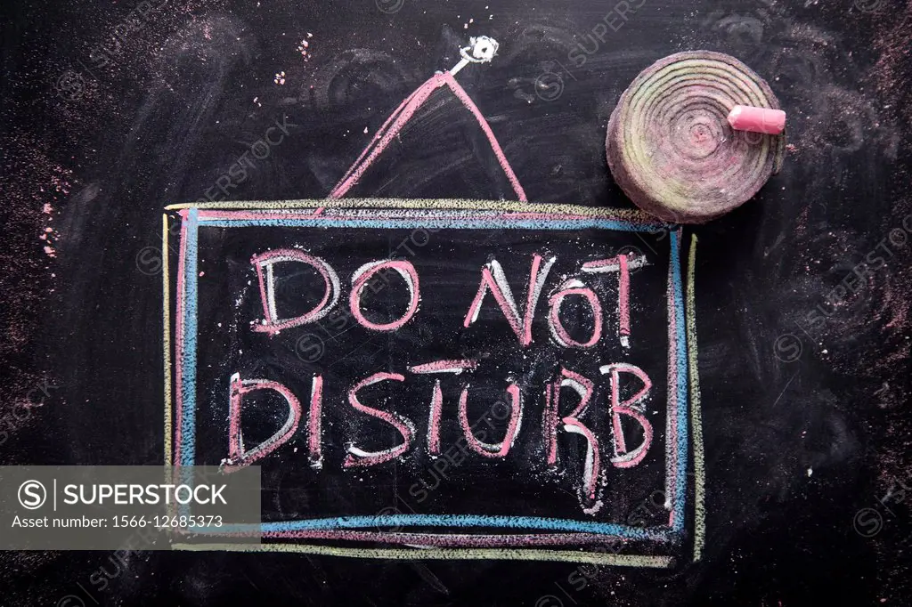 Graphic representation of the word, do not disturb, written with chalk on blackboard.