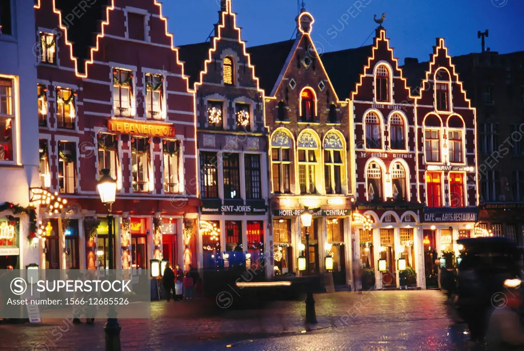 Iluminated buildings in the Grot Markt , Bruges, Belgium.
