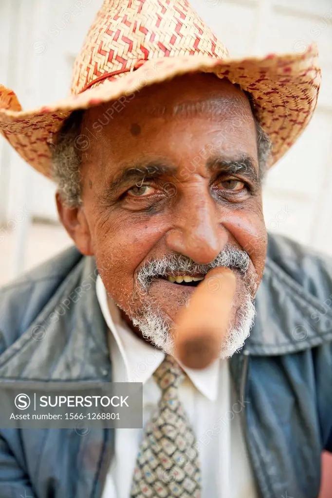 elderly man with hat, beard smoking cigar, Trinidad, Cuba, Caribbean