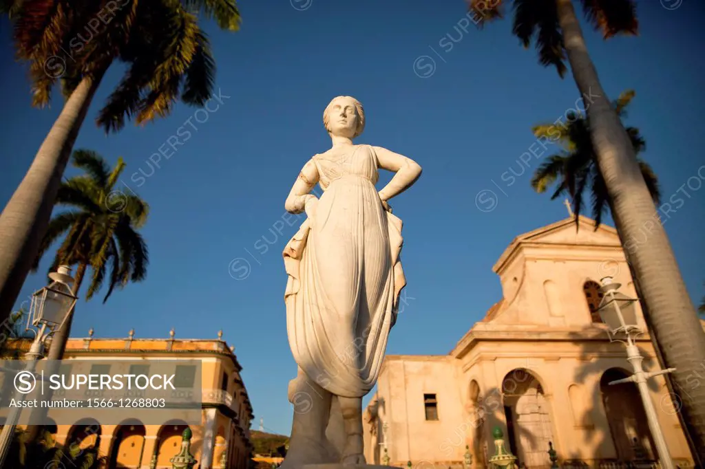 statue in front of the cathedral on the square Plaza Mayor in Trinidad, Cuba, Caribbean