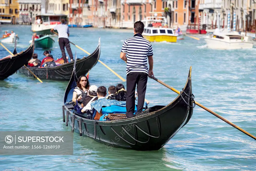 Venice - gondolier flows on the gondola through the Grand Canal (Canal Grande), Venice, Italy, UNESCO.