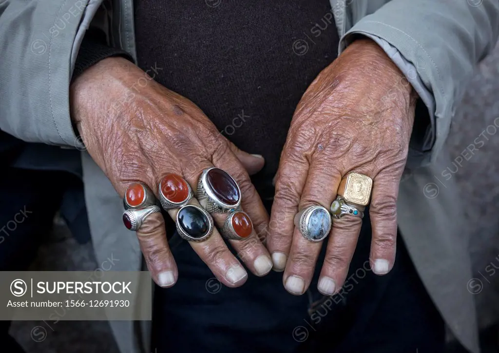 Iran, Shemiranat County, Tehran, man selling rings in tajrish bazaar.