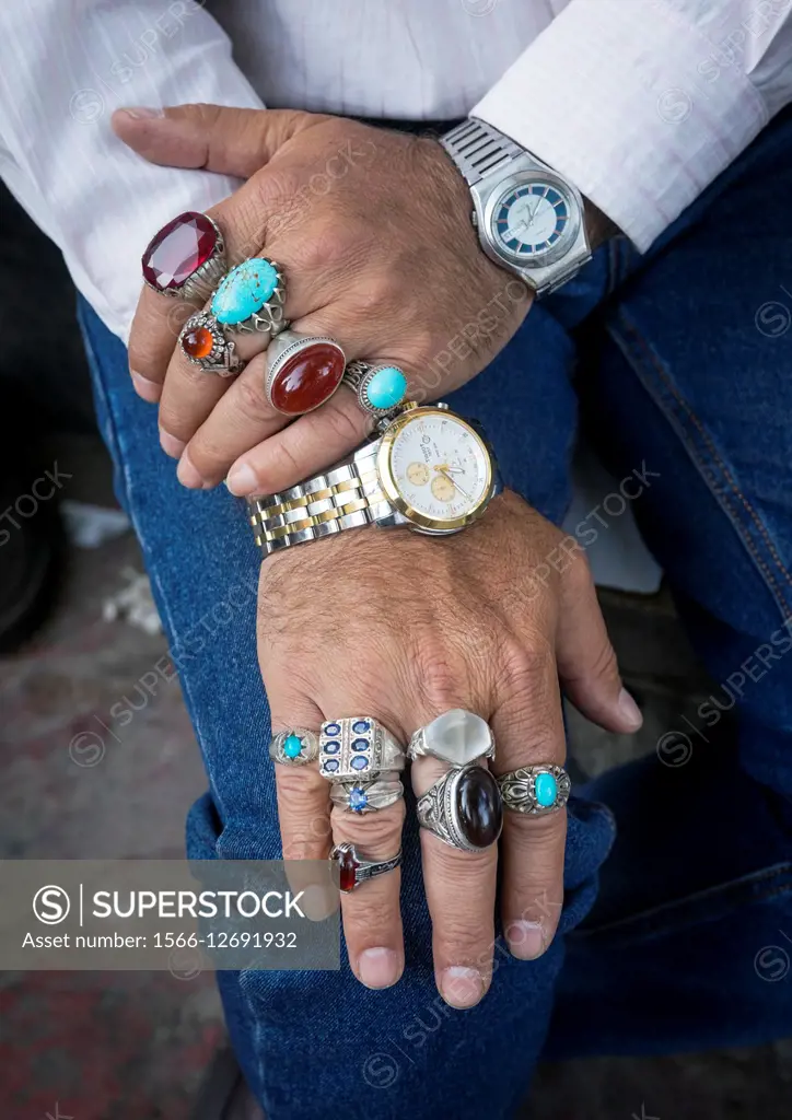 Iran, Shemiranat County, Tehran, man selling rings in tajrish bazaar.