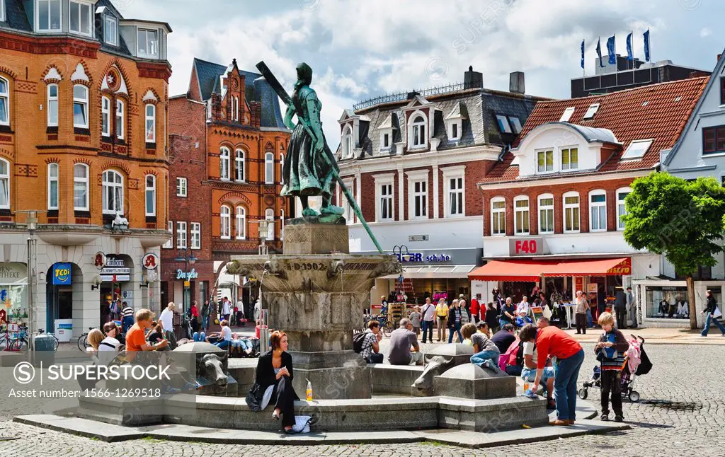 Northern Friesland, Tine-Well at Husum Market Place. The statue of Anna Catarina Asmussen, nicknamed 'Tine' was created by Adolf Brí¼tt.