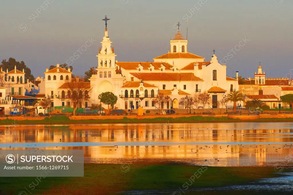 El Rocio village and Hermitage at Sunset, Almonte El Rocio, El Rocio Marismas de Doñana, Doñana National Park, Huelva province, Andalusia Spain