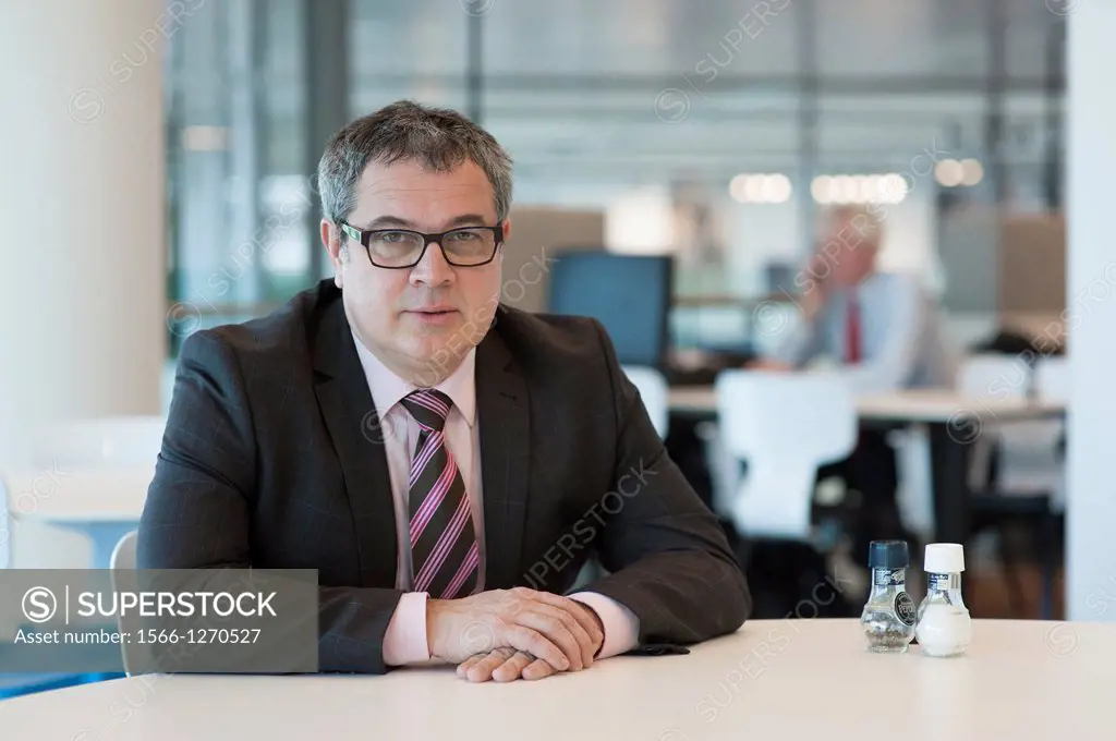 Utrecht, Netherlands. Portrait of a manager, working at a large financial institution.