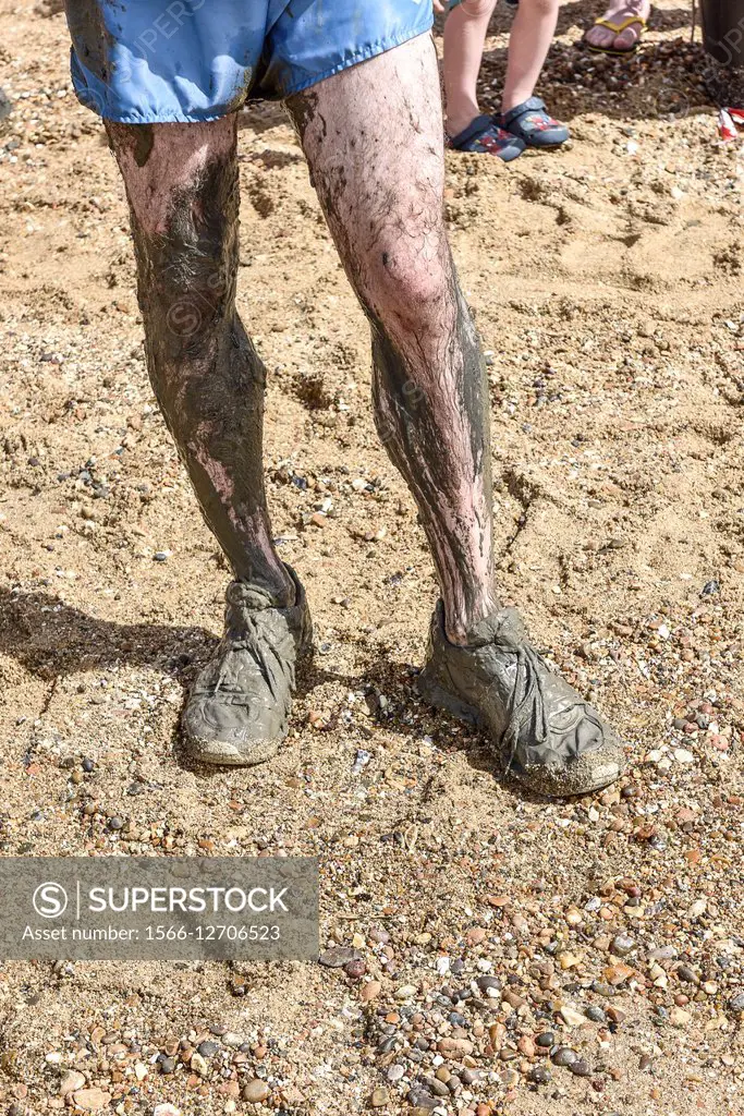 The muddy legs of a runner.