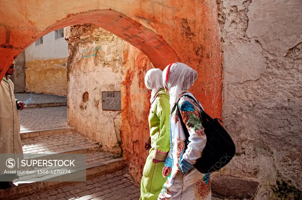 Women walking by the streets of Moulay Idriss  Morocco