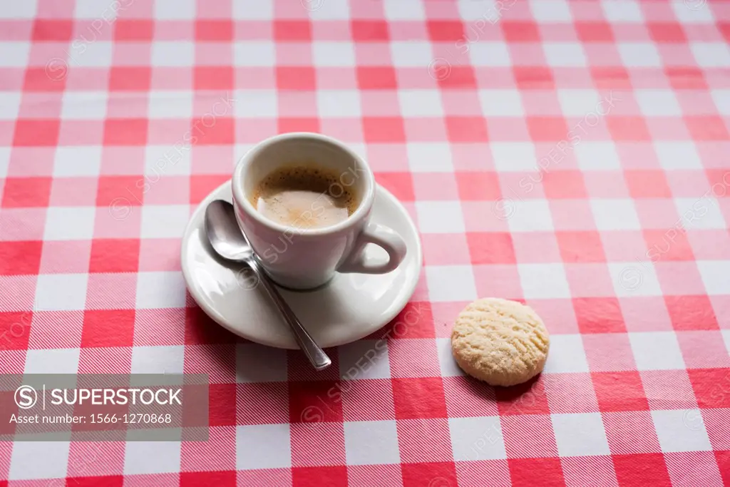 Cup of espresso and a biscuit