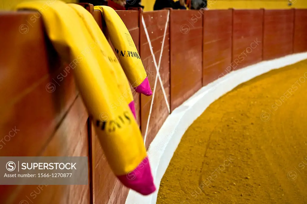 Bullfighter´s capes on the burladero or barrier, Spain