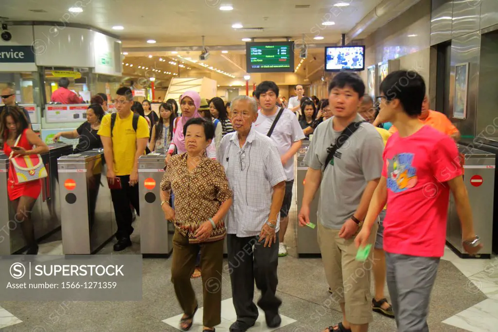 Singapore, City Hall MRT Station, East West Line, subway train, public transportation, Asian, woman, man, couple, senior, commuters, turnstile, exitin...