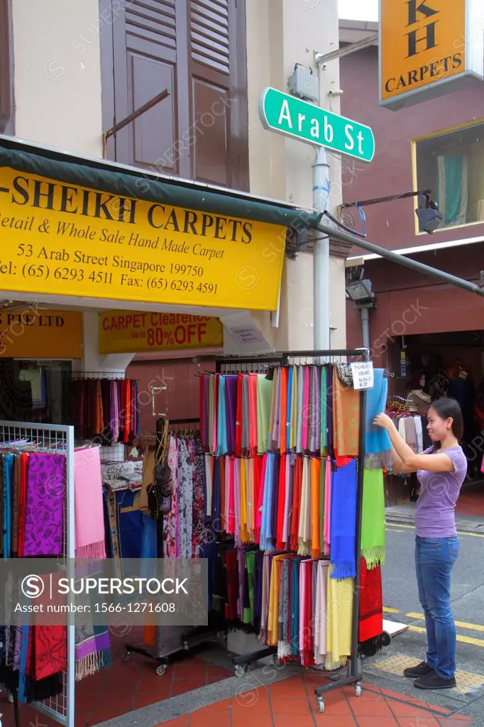 Singapore, Kampong Glam, Muslim Quarter, Arab Street, textile, merchant, fabric, carpets, front, entrance, business, for sale, display, Asian, woman, ...
