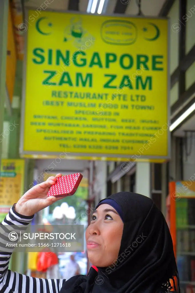 Singapore, Kampong Glam, Muslim Quarter, North Bridge Road, restaurant, Zam Zam, Asian, woman, Muslim, food, hijab, smart phone, taking picture,