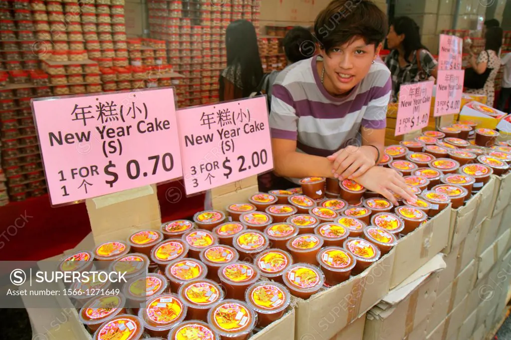 Singapore, Chinatown, shopping, market, marketplace, Asian, teen, boy, job, selling, Chinese New Year, cake, hanzi characters,