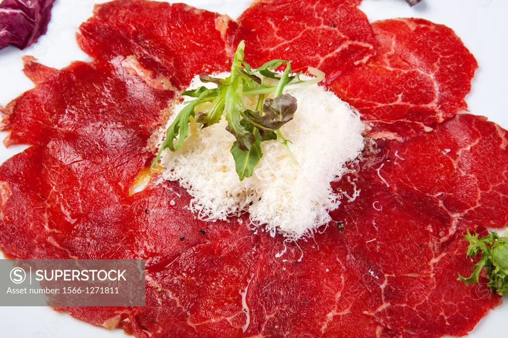 Beef carpaccio with parmesan cheese.