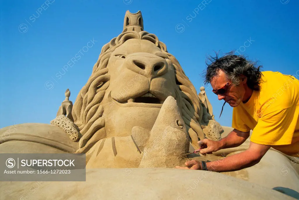 the Canadian artist Guy Beauregard working on his sculpture named The Lion and The Rat according to La Fontaine´s Fables, World Championship in Sand S...