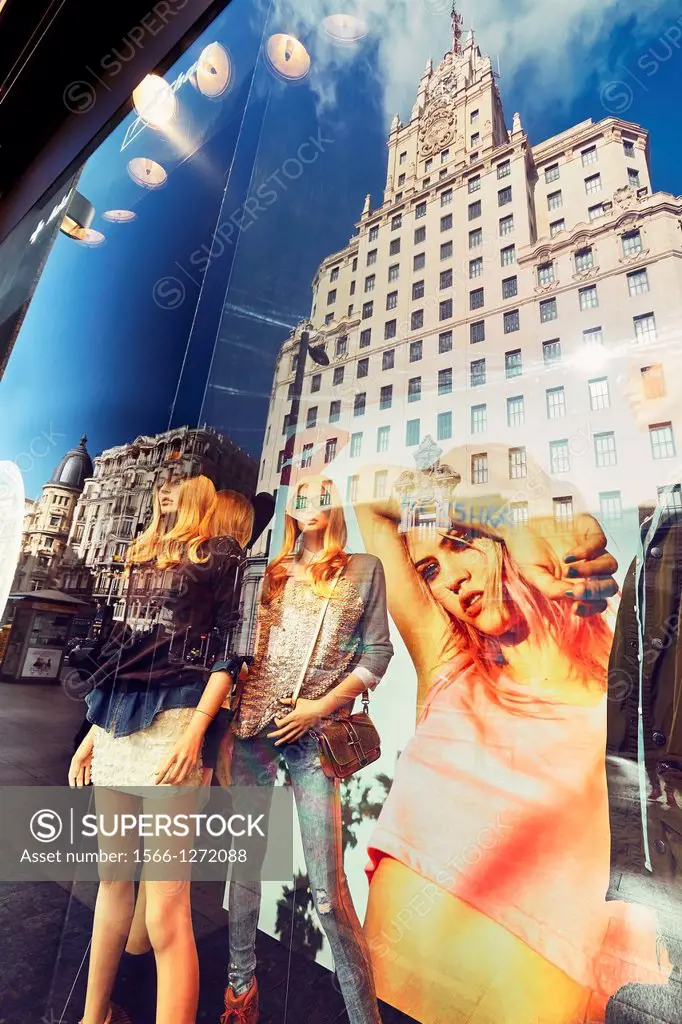 Mannequins and reflections at a window shop in Callao square. Madrid. Spain