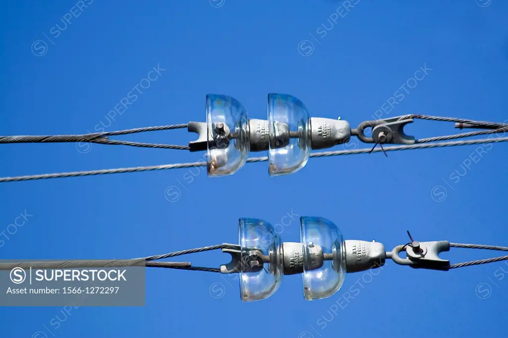 Railroad overhead lines against clear blue sky, Contact wire
