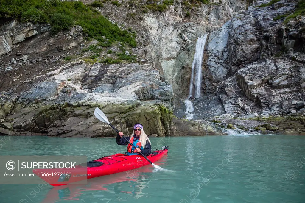 Lindblad Staff member CT Ticknor kayaking near the South Sawyer Glacier in the Tracy Arm-Ford's Terror Wilderness area, Southeast Alaska, USA.