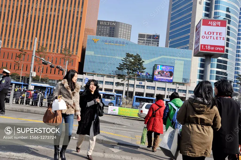 SEOUL SOUTH KOREA pedestrians at bus stop.