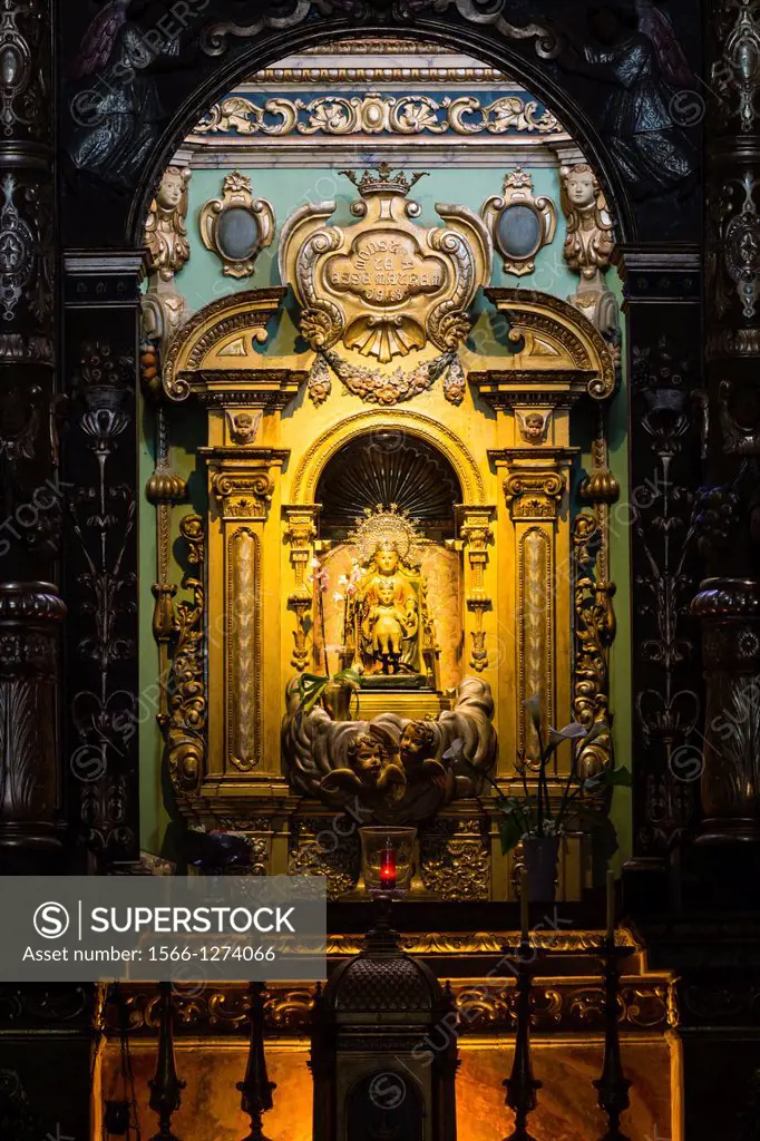 presbytery Baroque altarpiece, camarin of Mare de Deu de Bonany, a woodcarving tradition that attributes to medieval times, sitting in a chair with th...