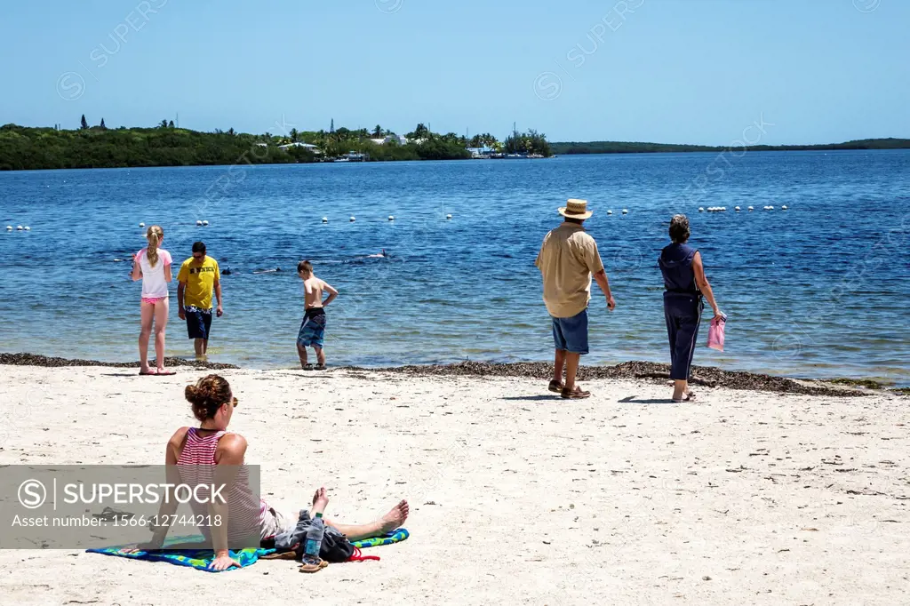 Florida, Keys, Key Largo, John Pennekamp Coral Reef State Park, Largo Sound, Atlantic Ocean, sand, beach, sunbathers, family, water,