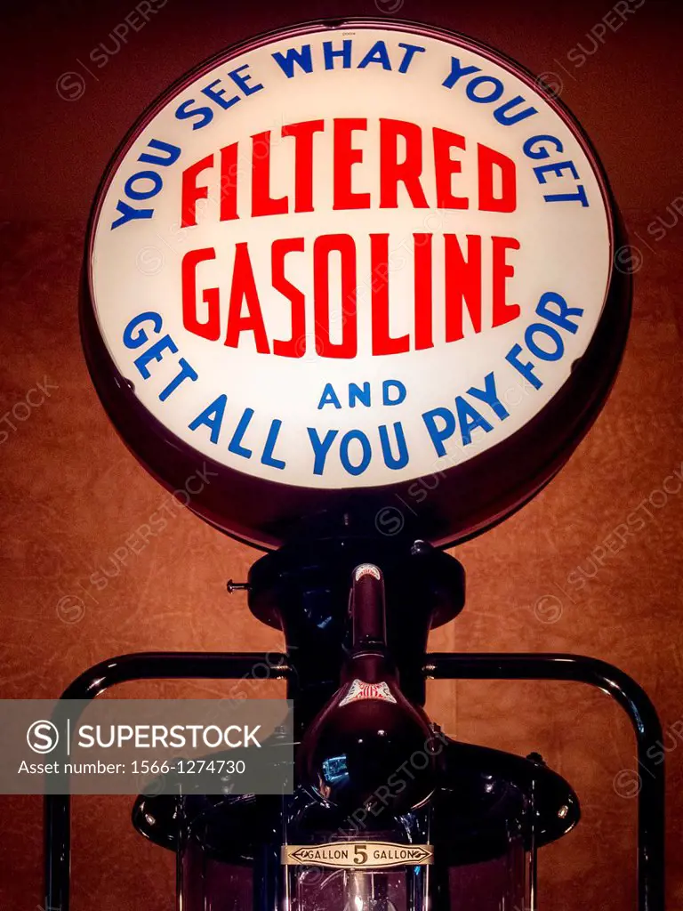 An illuminated advertising sign on a 1935 Bennett 150 service station gasoline pump promises a fair deal for the customer.An illuminated advertising s...