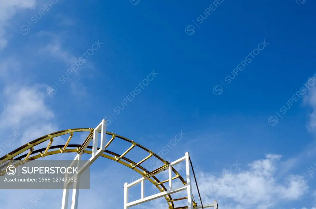 A roller coaster against a blue sky. Brighton Peir, East Sussex, England.