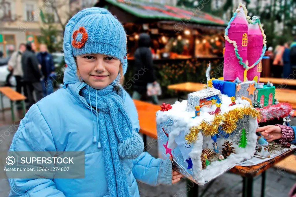 a competition and annual exhibition of Christmas cribs stand on the Main market square, Krakow, Poland, Central Europe
