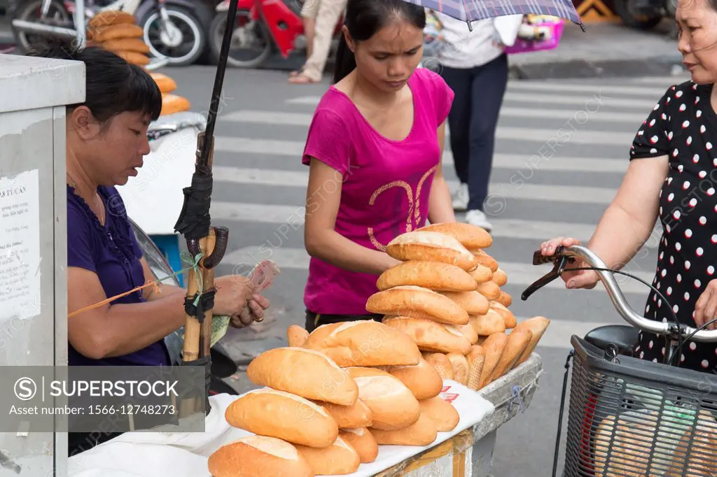 Vietnamese lady Selling Fresh bread in Hanoi Old Quarter.