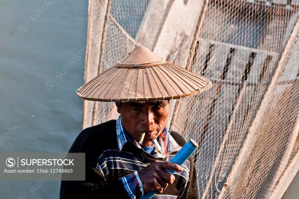 Fisherman on boat, Inle lake, Myanmar