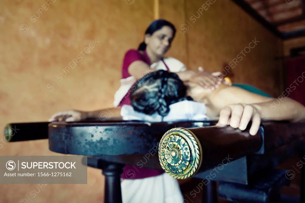 woman ayurveda traditional indian oil head massage.