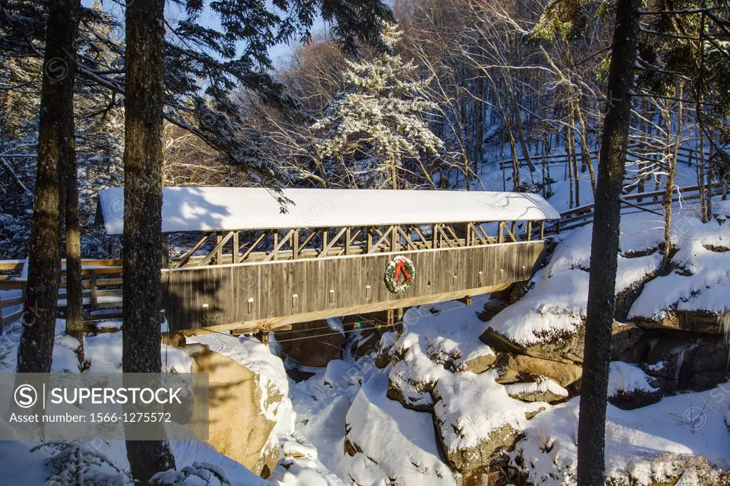 Franconia Notch State Park - Sentinel Pine Covered Bridge during the winter months. It is a footbridge which crosses over the Pemigewasset River in Li...