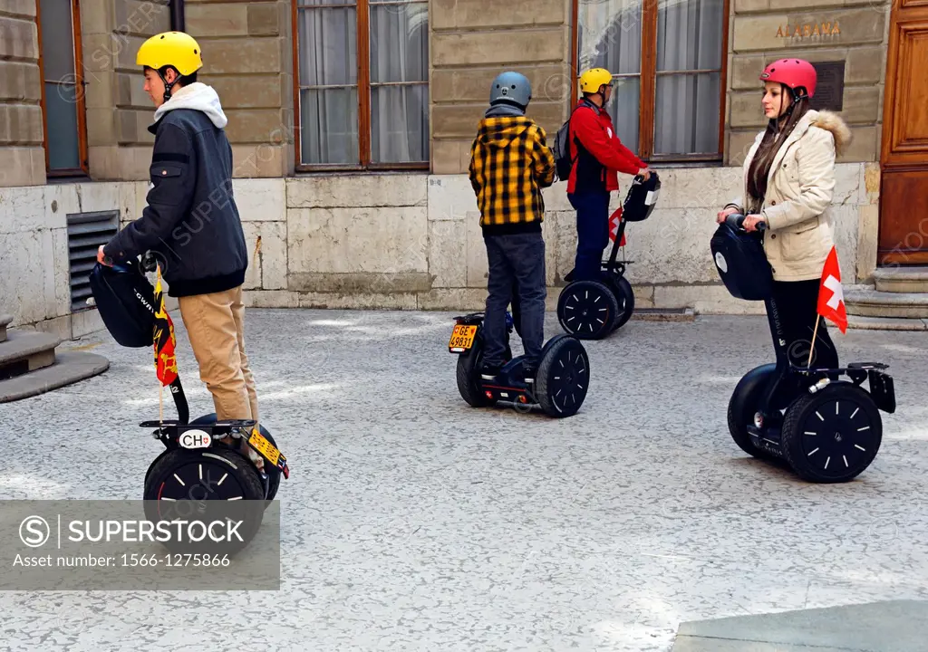 new way of touristic sightseeing on Segway, two-wheeled, self-balancing electric vehicle invented by Dean Kamen , Geneva, Switzerland, here the group ...