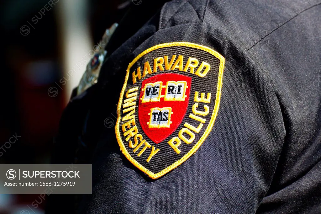 Harvard University Police Department (HUPD) patch on the sleeve of an officer's uniform.