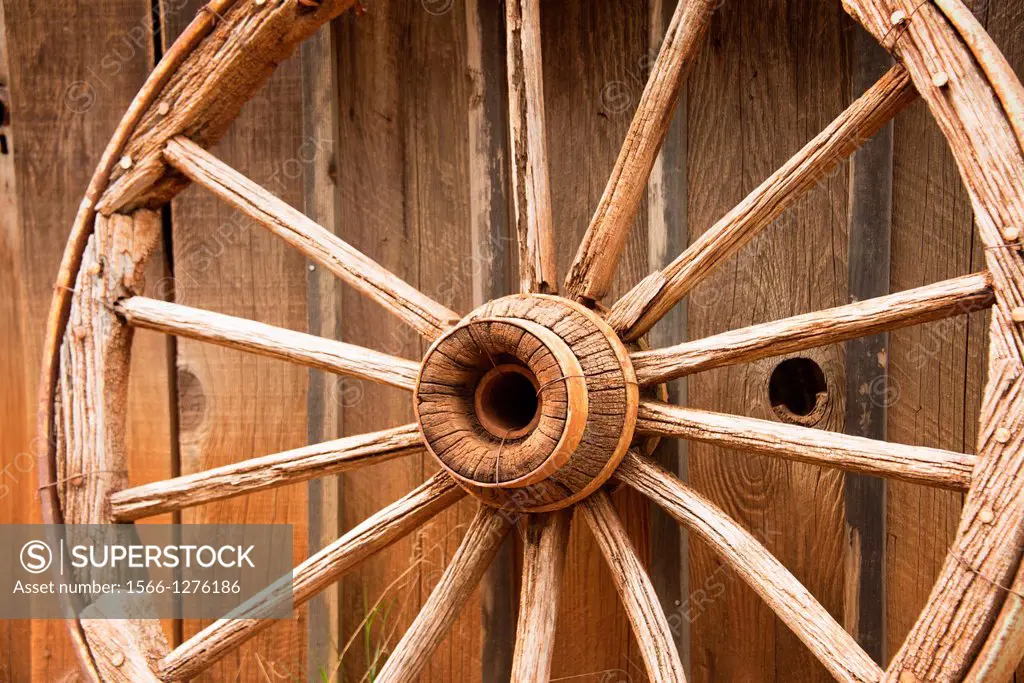 An old wagon wheel evokes memories of the wild west.