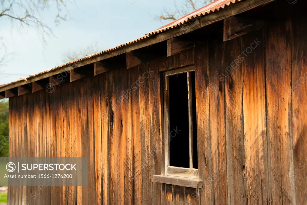 An old barn's window shows the character of the building.