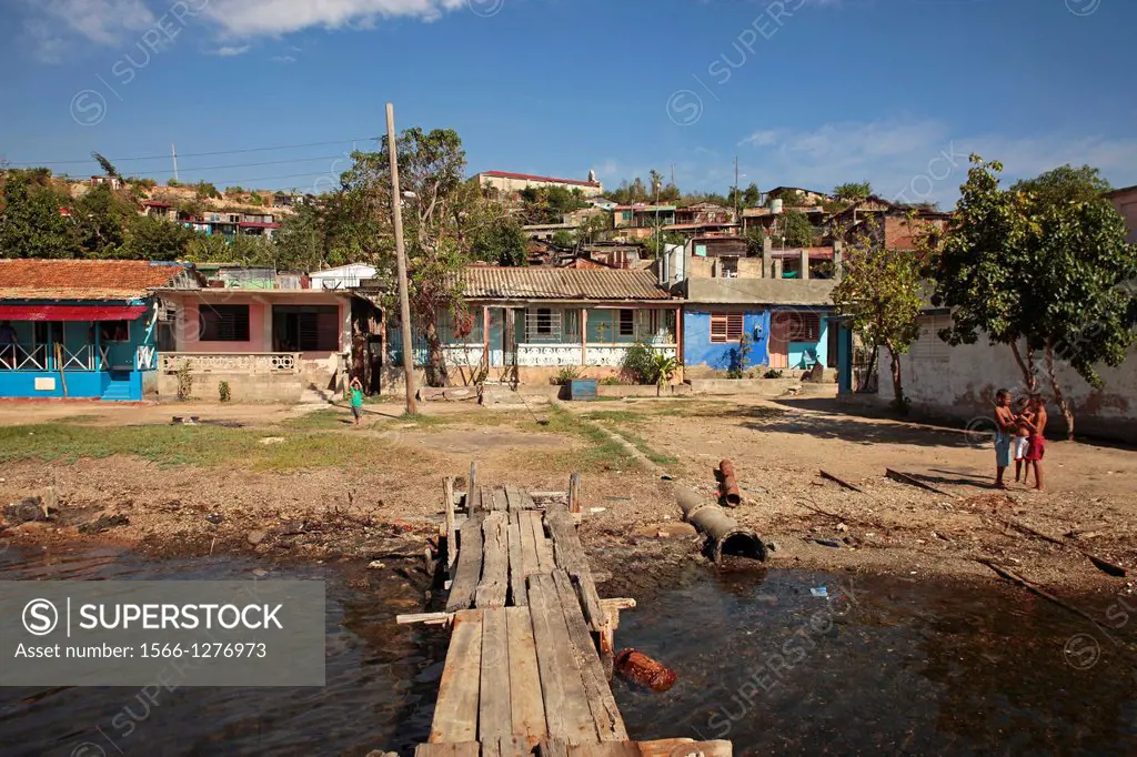 pier and homes on the island Cayo Granma, island near Santiago de Cuba, Cuba, Carribean.