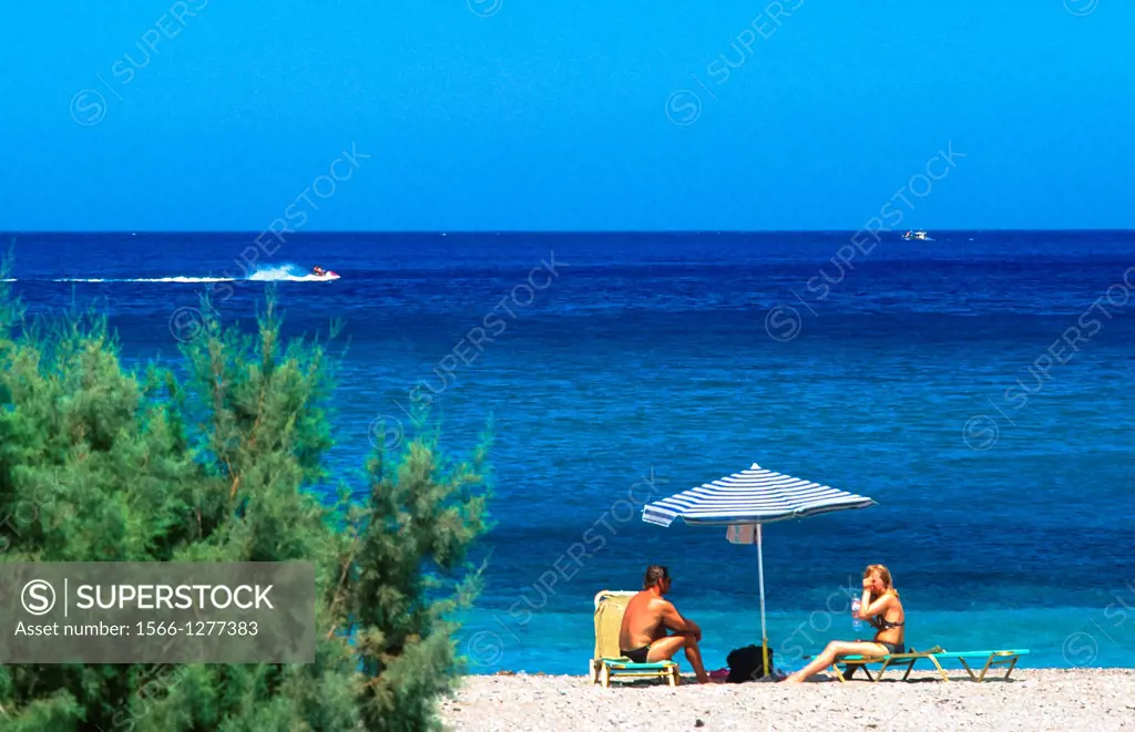 couple at the beach at Karpathos island, Greece