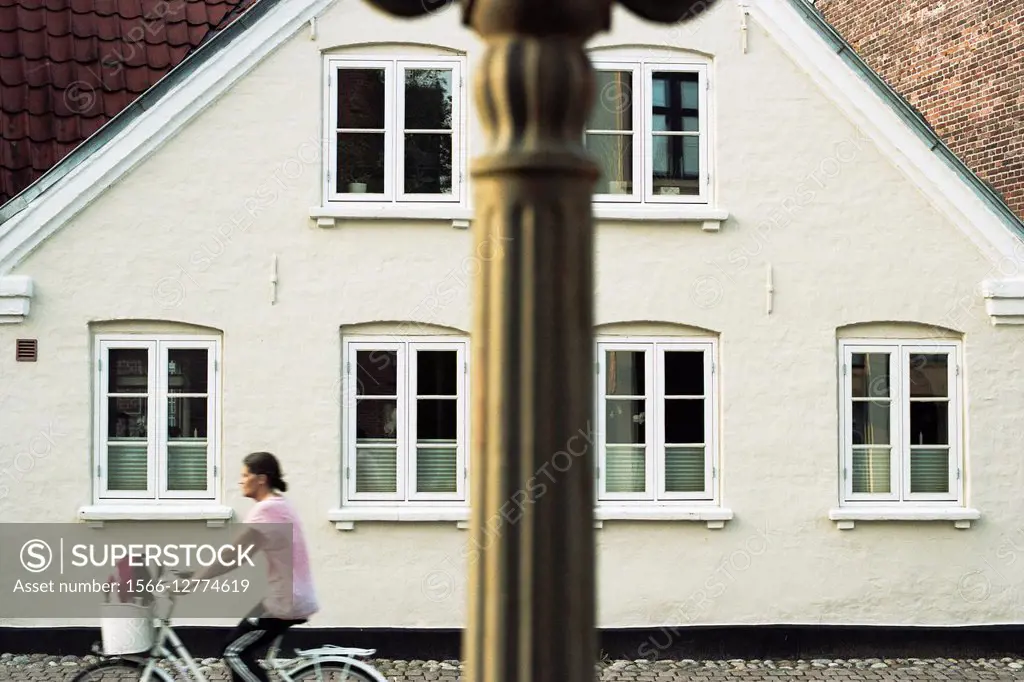 Girl riding a bike, Ribe. Denmark.