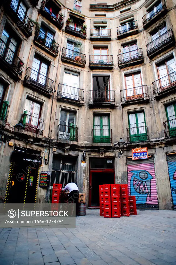 Traditional street with balconies in the Gothic area of Barcelona.