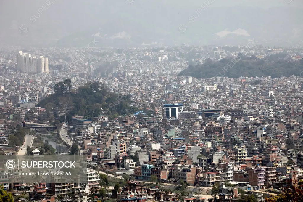 Nepal, City of Kathmandu, buddhist temple of Swayambhunath (or monkeys temple) built on top of a hill, overview on the polluted city