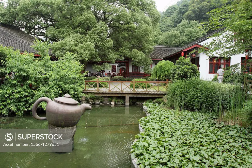 Chinese garden decorate with big teapot in meddle of the pond, china, asia